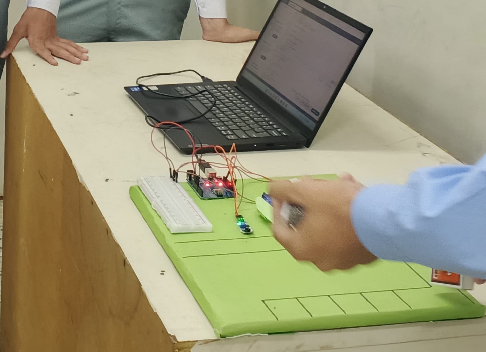 Student programming an Arduino microcontroller